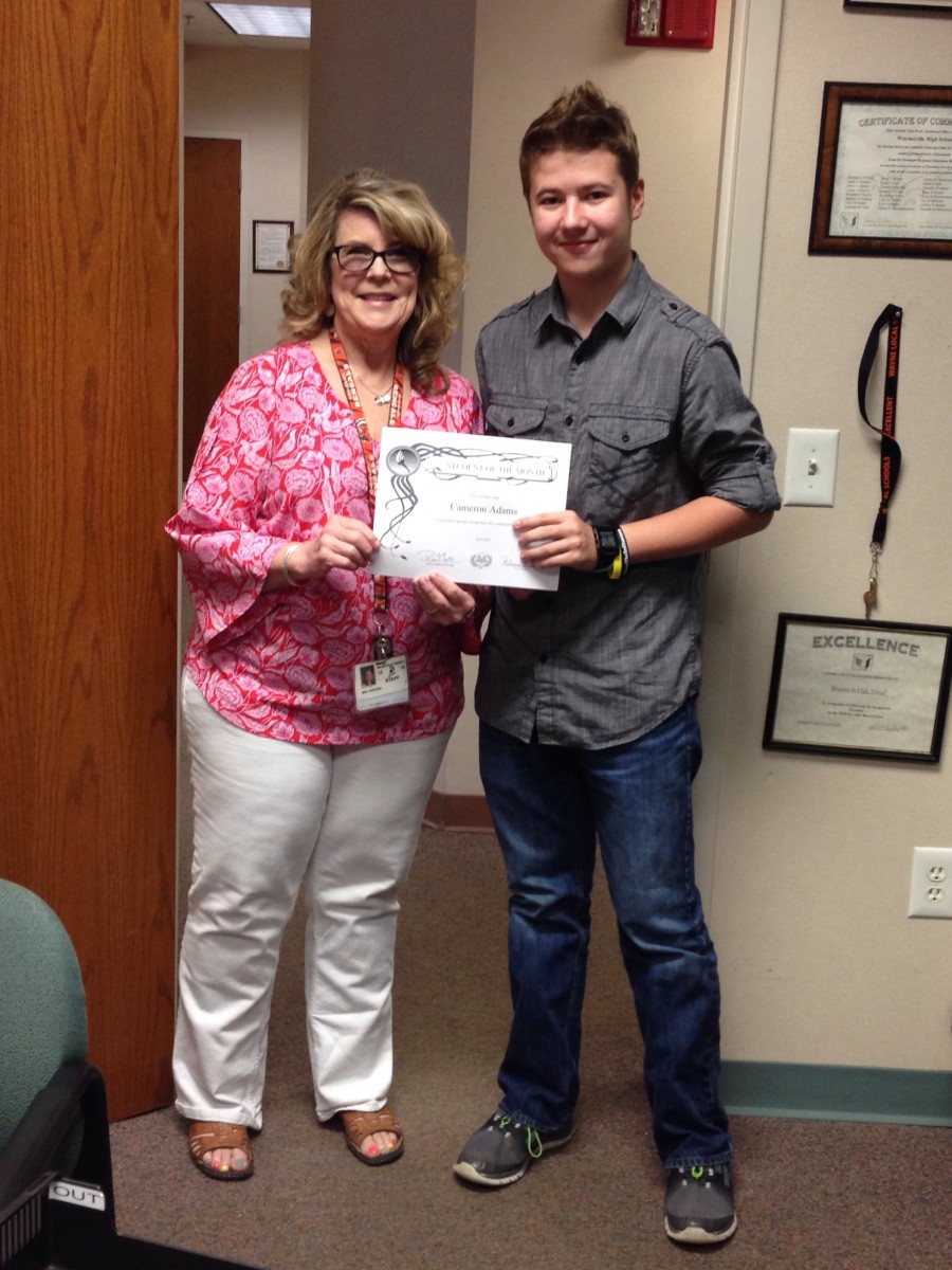 image of two people holding a certificate